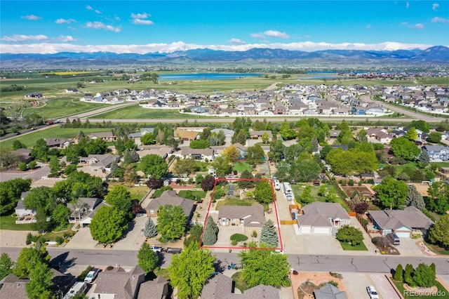 aerial view of residential area with a water and mountain view and property boundaries highlighted