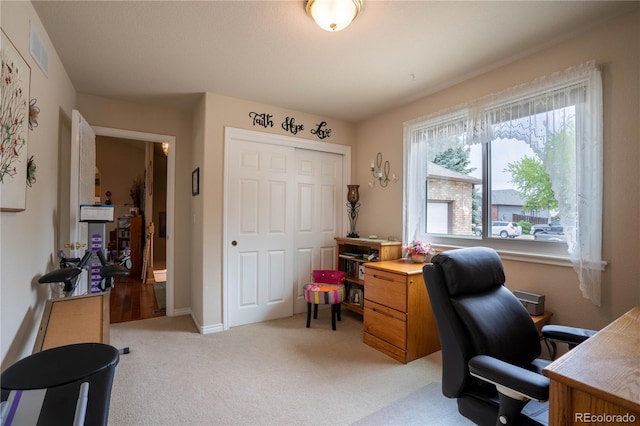 office featuring light colored carpet and baseboards