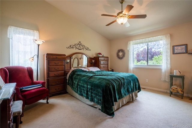 bedroom with light carpet, vaulted ceiling, baseboards, and ceiling fan