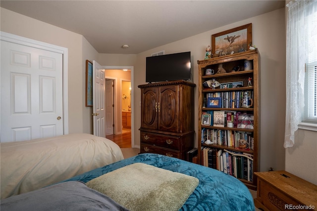 bedroom with wood finished floors