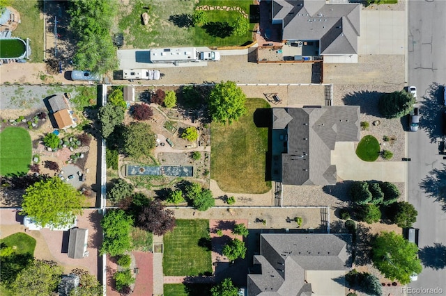 aerial view of property and surrounding area with nearby suburban area