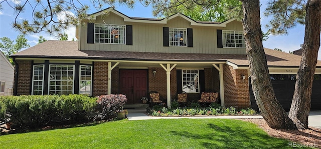 7655 S Ogden Way, Centennial, CO 80122 - traditional-style home featuring brick siding, a front yard, a porch, and an attached garage
