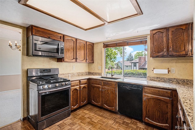 7655 S Ogden Way, Centennial, CO 80122 - kitchen featuring stainless steel appliances and a sink