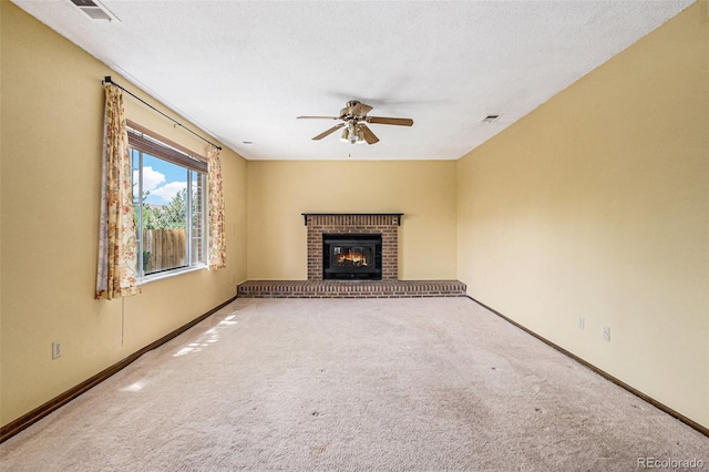 7655 S Ogden Way, Centennial, CO 80122 - unfurnished living room featuring carpet flooring, ceiling fan, and a fireplace