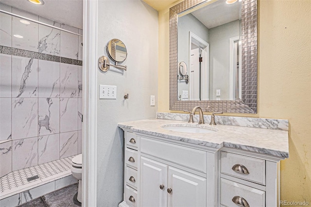 7655 S Ogden Way, Centennial, CO 80122 - bathroom featuring a shower stall, toilet, and vanity