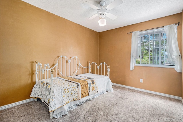 7655 S Ogden Way, Centennial, CO 80122 - carpeted bedroom featuring baseboards, a textured ceiling, and a ceiling fan