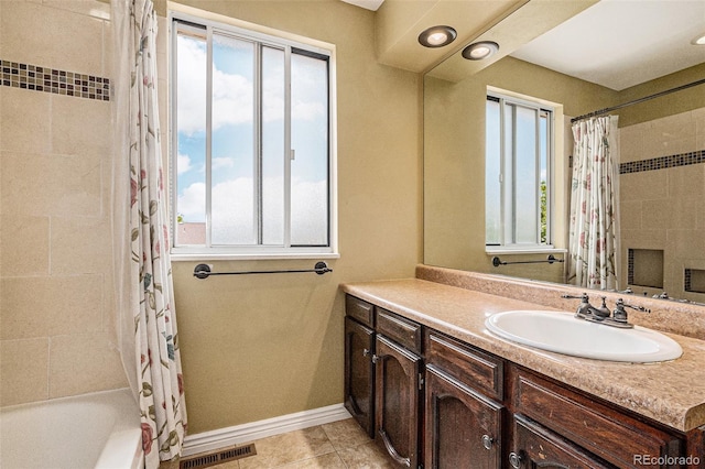 7655 S Ogden Way, Centennial, CO 80122 - full bathroom featuring vanity, shower / bath combo, tile patterned flooring, and baseboards