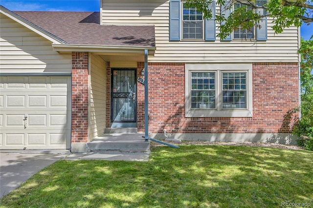 9946 Harrison St, Thornton, CO 80229 - view of exterior entry with a lawn, an attached garage, brick siding, roof with shingles, and concrete driveway