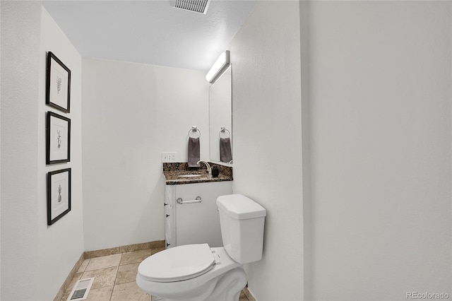 9946 Harrison St, Thornton, CO 80229 - bathroom with baseboards, vanity, and toilet