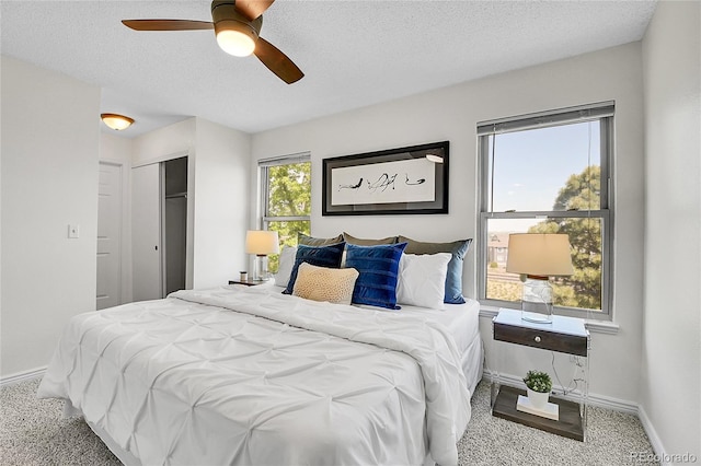 9946 Harrison St, Thornton, CO 80229 - carpeted bedroom with baseboards, a textured ceiling, a closet, and ceiling fan