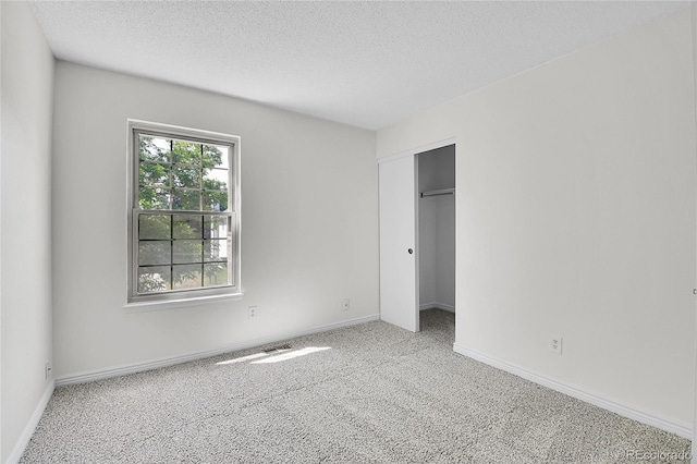 9946 Harrison St, Thornton, CO 80229 - unfurnished bedroom with carpet floors, a textured ceiling, baseboards, and a closet