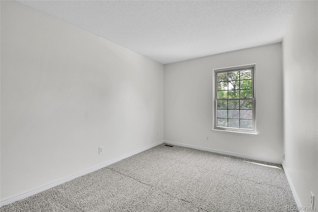 9946 Harrison St, Thornton, CO 80229 - carpeted spare room featuring a textured ceiling and baseboards