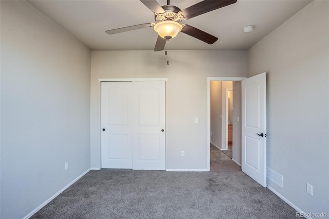 unfurnished bedroom featuring a closet, visible vents, baseboards, and carpet