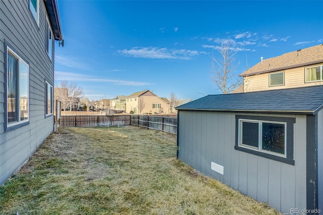 view of yard with a residential view and a fenced backyard