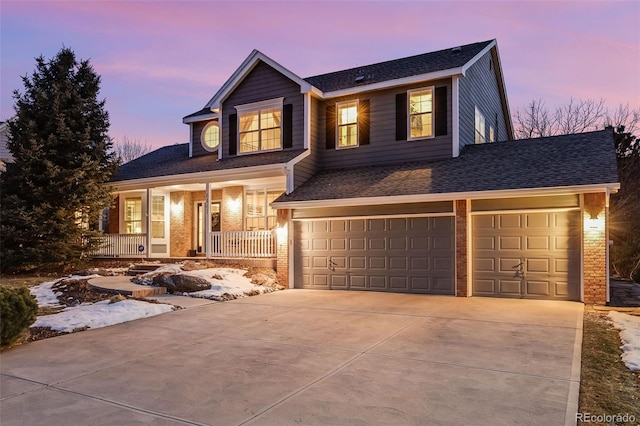 view of front of home featuring a garage and covered porch