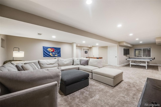 living room featuring carpet floors and a wall mounted air conditioner