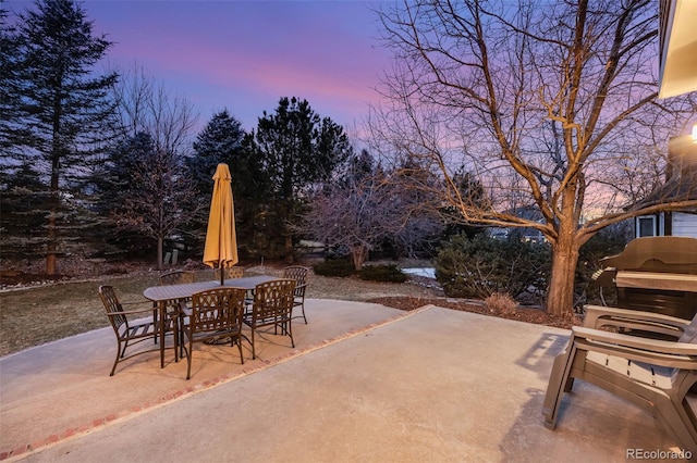 view of patio terrace at dusk