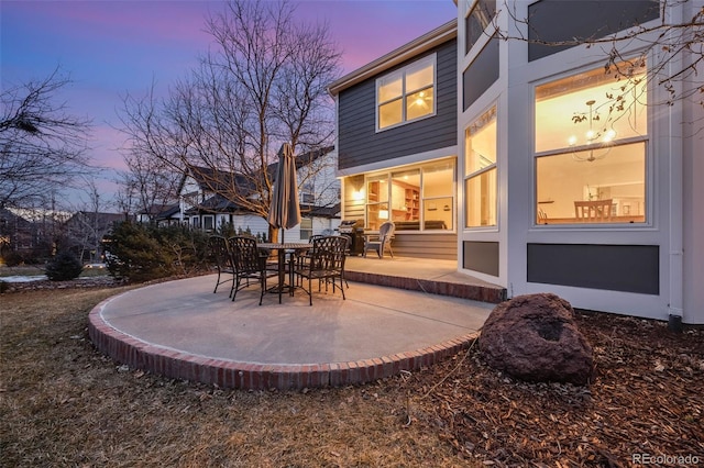 view of patio terrace at dusk