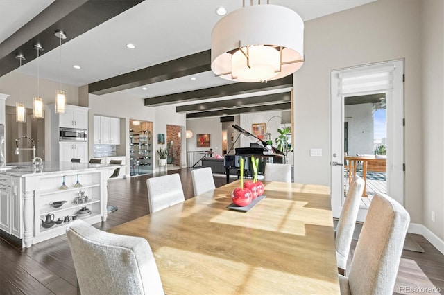 dining space featuring recessed lighting, baseboards, dark wood finished floors, and beamed ceiling