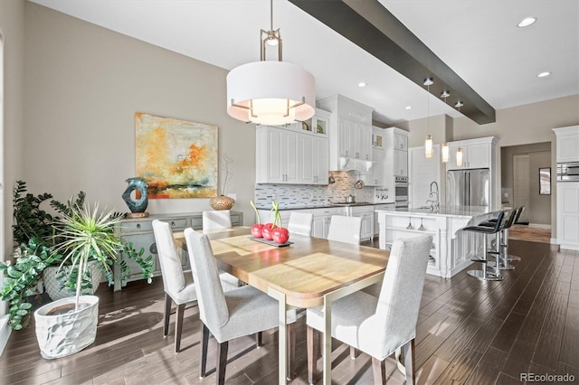 dining area featuring recessed lighting, dark wood-style flooring, and beamed ceiling