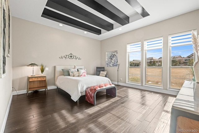 bedroom featuring baseboards, dark wood finished floors, beam ceiling, and recessed lighting