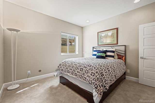 carpeted bedroom featuring baseboards