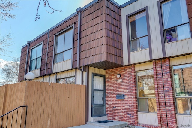 view of building exterior featuring fence