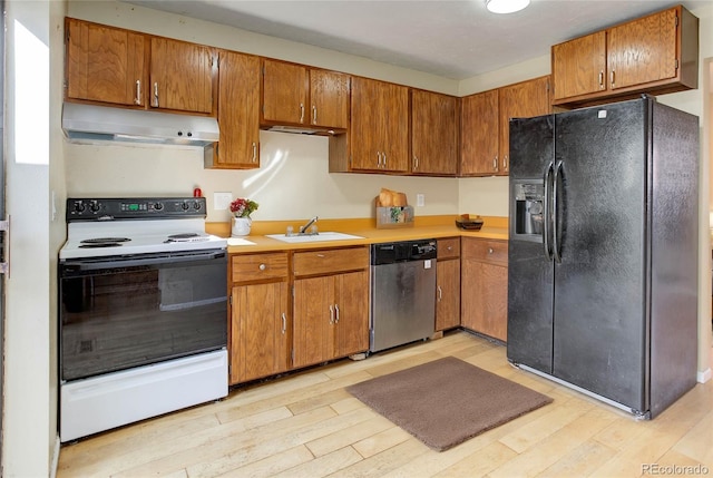 kitchen featuring under cabinet range hood, electric range oven, stainless steel dishwasher, black refrigerator with ice dispenser, and a sink