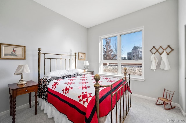 bedroom featuring light carpet and baseboards