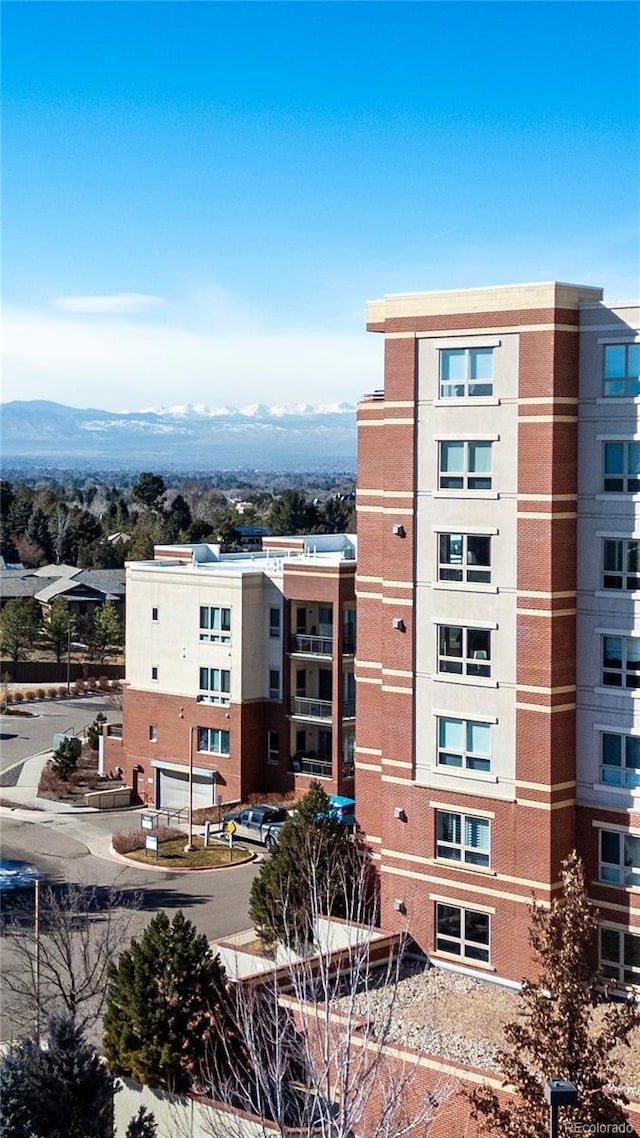 view of building exterior with a mountain view