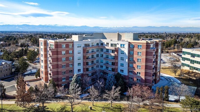 view of building exterior featuring a mountain view