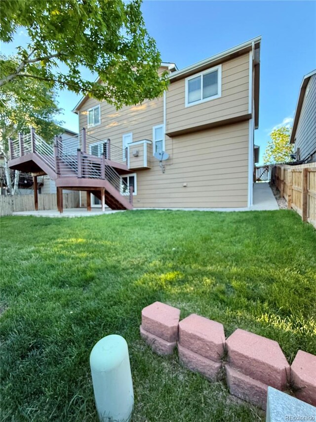 23760 Broadmoor Dr, Parker, CO 80138 - back of property featuring stairs and a wooden deck
