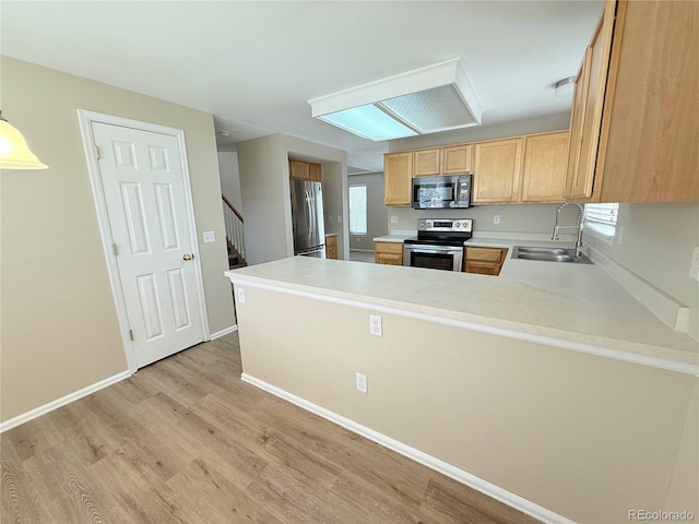23760 Broadmoor Dr, Parker, CO 80138 - kitchen featuring appliances with stainless steel finishes, a sink, light wood-type flooring, light countertops, and light brown cabinets