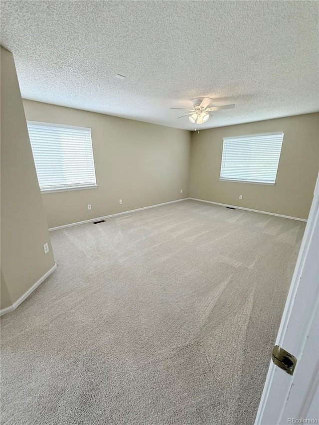 23760 Broadmoor Dr, Parker, CO 80138 - carpeted spare room featuring ceiling fan, baseboards, and a textured ceiling