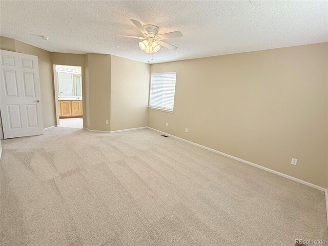 23760 Broadmoor Dr, Parker, CO 80138 - unfurnished room with a textured ceiling, a ceiling fan, baseboards, and light carpet