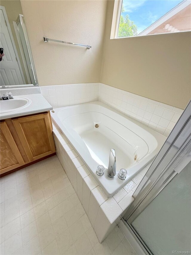 23760 Broadmoor Dr, Parker, CO 80138 - bathroom with a tub with jets and vanity