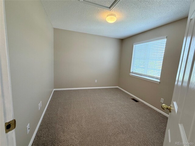 23760 Broadmoor Dr, Parker, CO 80138 - carpeted spare room featuring a textured ceiling and baseboards