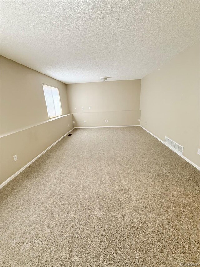 23760 Broadmoor Dr, Parker, CO 80138 - carpeted spare room featuring baseboards and a textured ceiling
