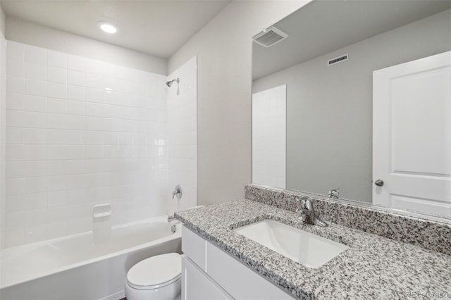 bathroom featuring vanity, toilet, visible vents, and shower / bath combination