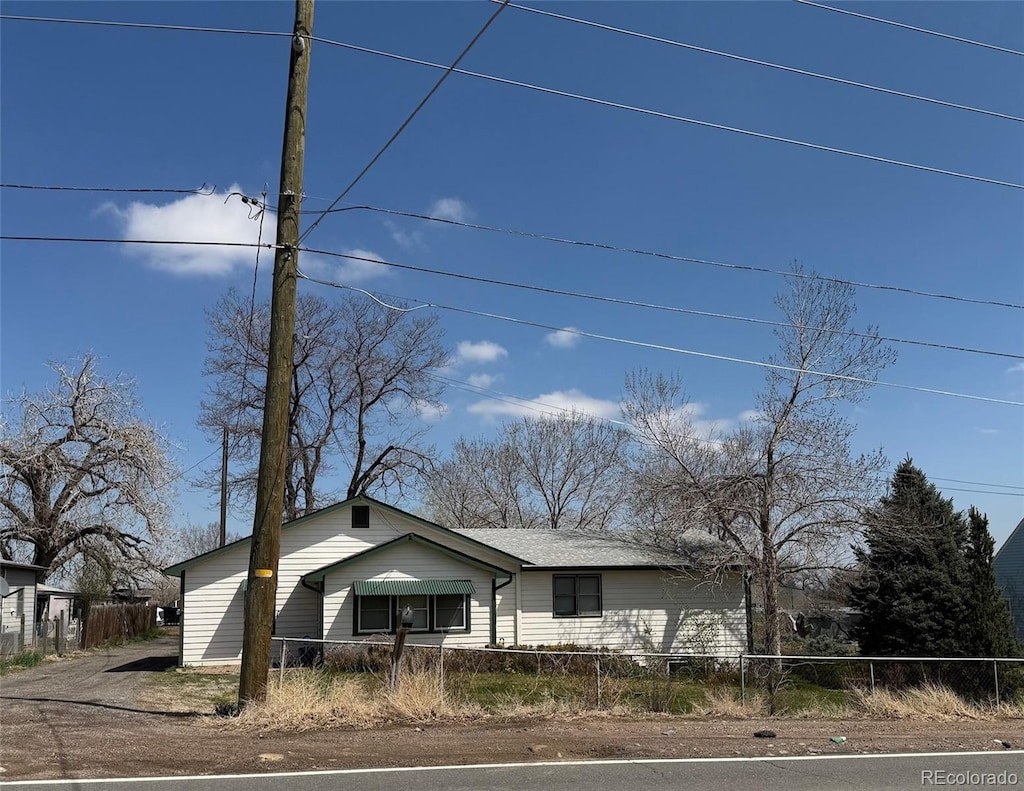 7750 Indiana St, Arvada, CO 80007 - view of front facade with a fenced front yard