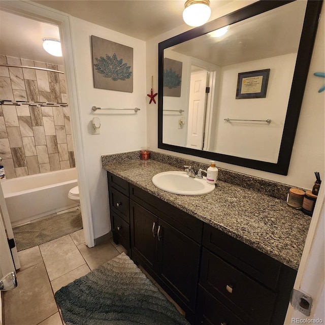 384 S Ironton St Unit 102, Aurora, CO 80012 - bathroom with vanity, tile patterned flooring, and bathing tub / shower combination