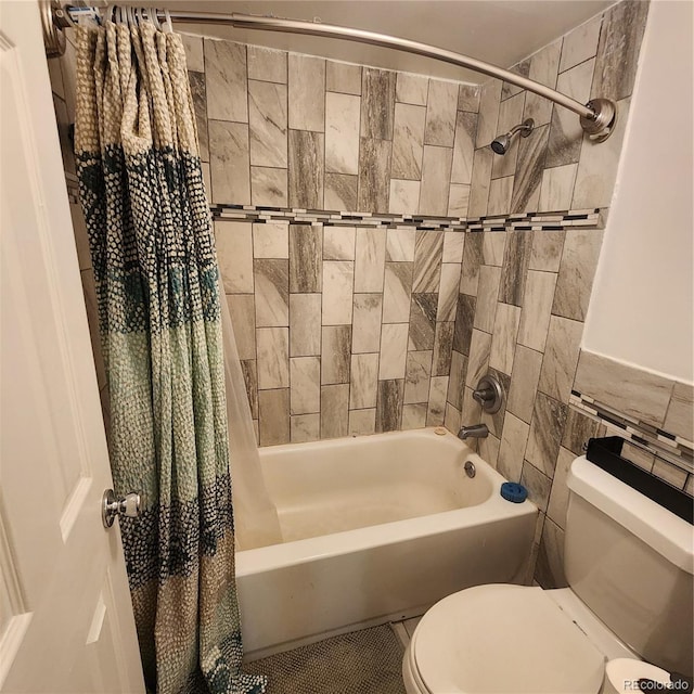 384 S Ironton St Unit 102, Aurora, CO 80012 - bathroom with shower / tub combo with curtain and tile walls