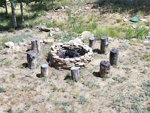 view of yard with an outdoor fire pit