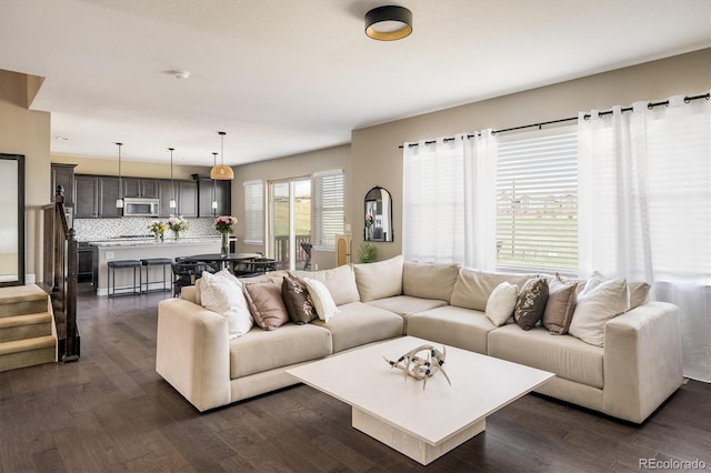 14807 Haley Ave, Parker, CO 80134 - living room featuring dark wood-style flooring and stairway