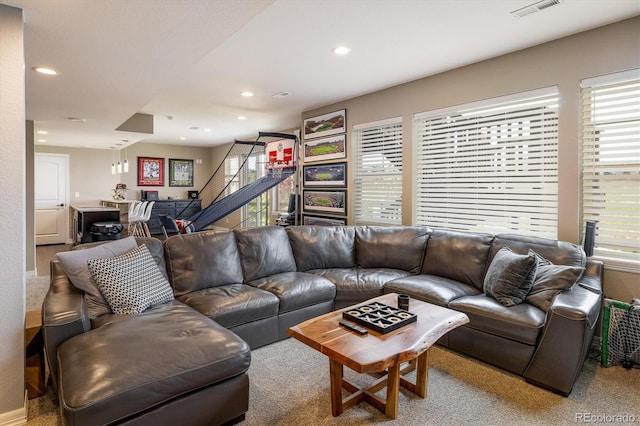 14807 Haley Ave, Parker, CO 80134 - living area featuring stairs, visible vents, carpet floors, and recessed lighting