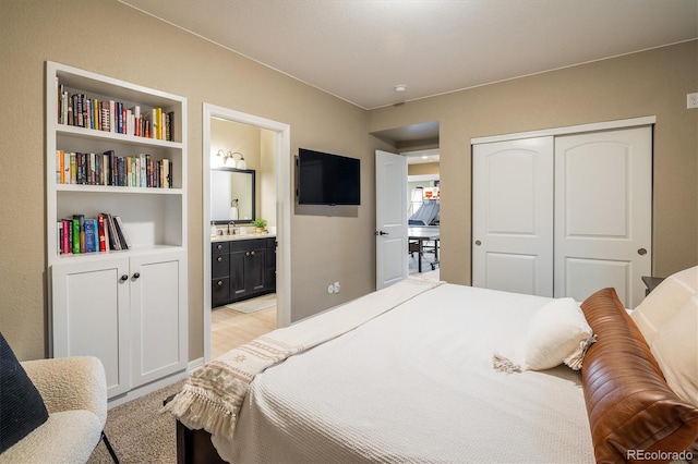 14807 Haley Ave, Parker, CO 80134 - bedroom featuring ensuite bath, a sink, and a closet