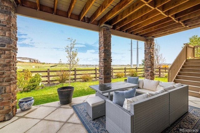 14807 Haley Ave, Parker, CO 80134 - view of patio featuring outdoor lounge area, outdoor dining area, stairway, and a fenced backyard