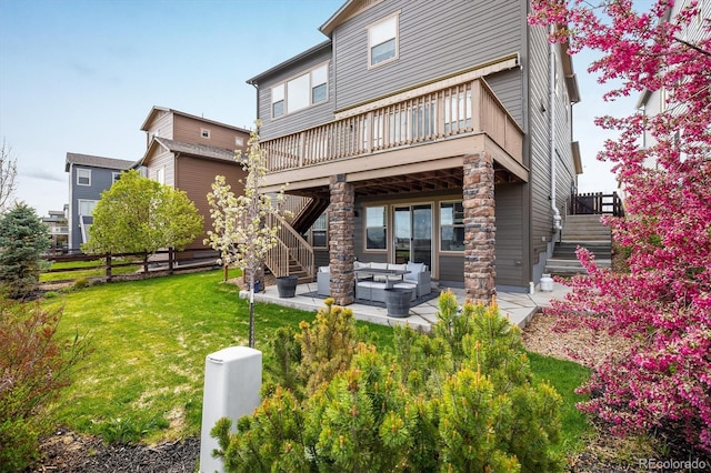 14807 Haley Ave, Parker, CO 80134 - rear view of property featuring an outdoor hangout area, a yard, stairway, and a patio area