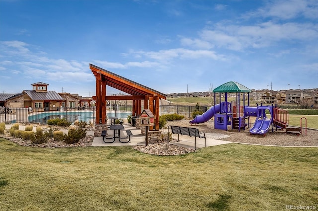 14807 Haley Ave, Parker, CO 80134 - community jungle gym featuring fence, a community pool, and a lawn