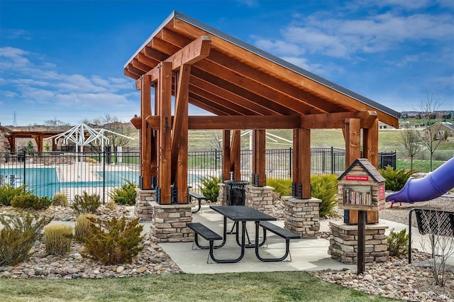 14807 Haley Ave, Parker, CO 80134 - view of patio / terrace featuring a community pool, fence, and a gazebo